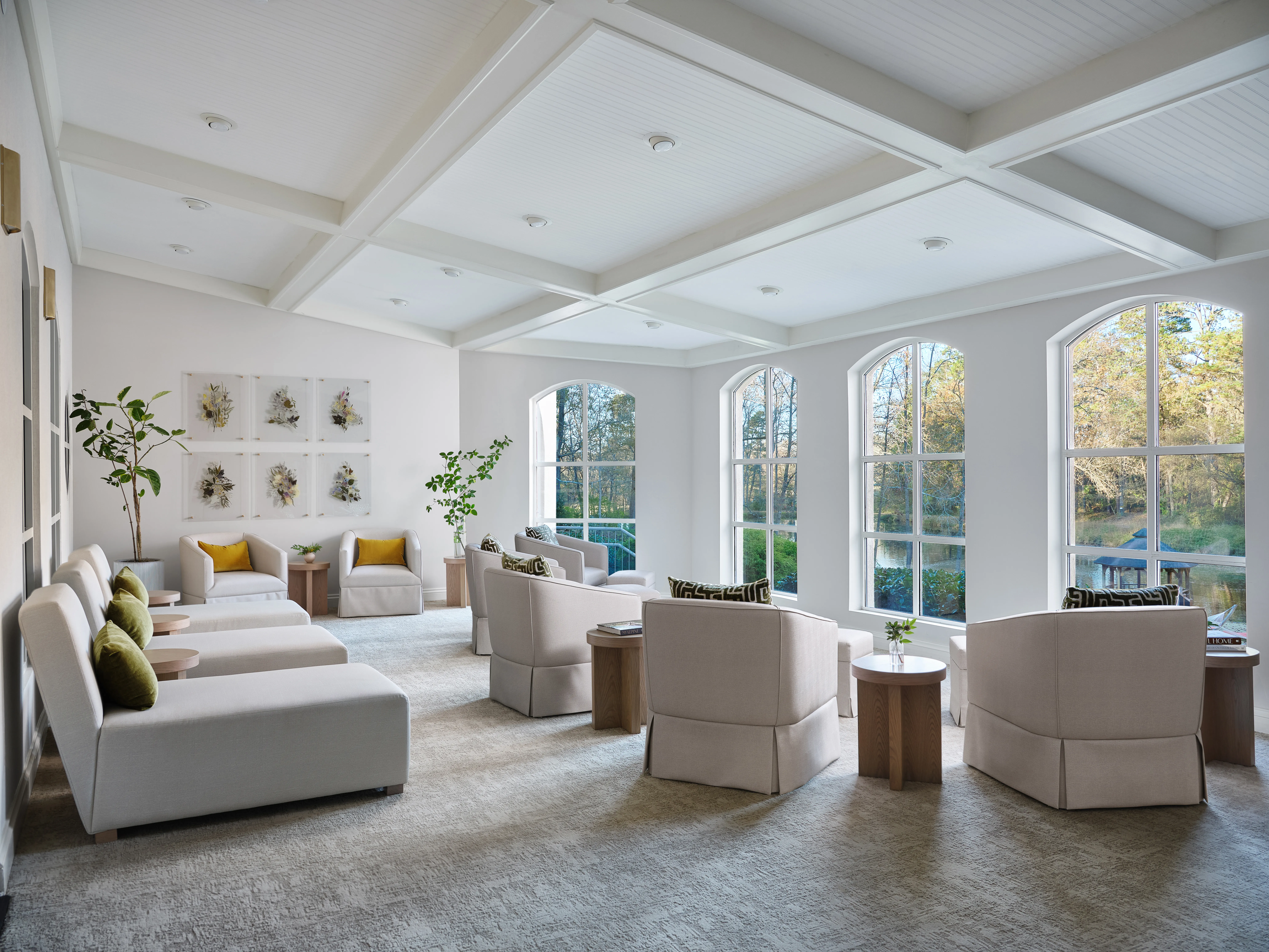 Bright lounge with armchairs and large windows