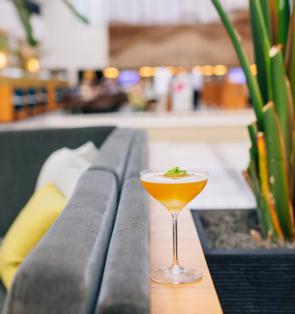 Cocktail glass on a table in a modern lounge