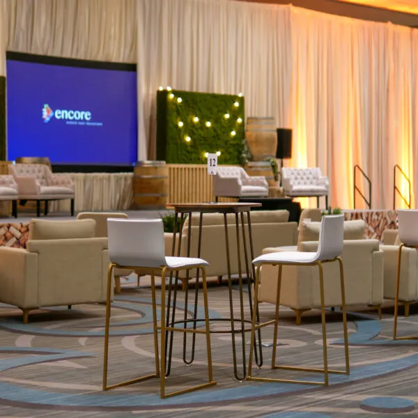 Event stage with chairs and screen