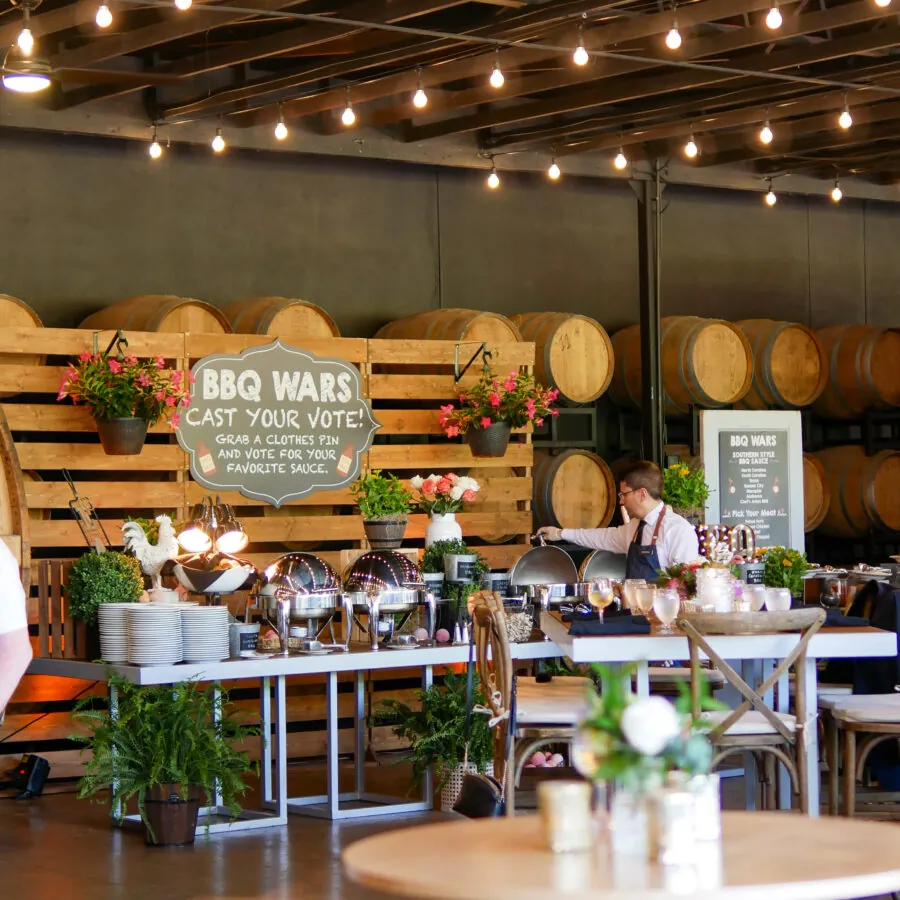 A dining area inside a restaurant with wooden tables and chairs.