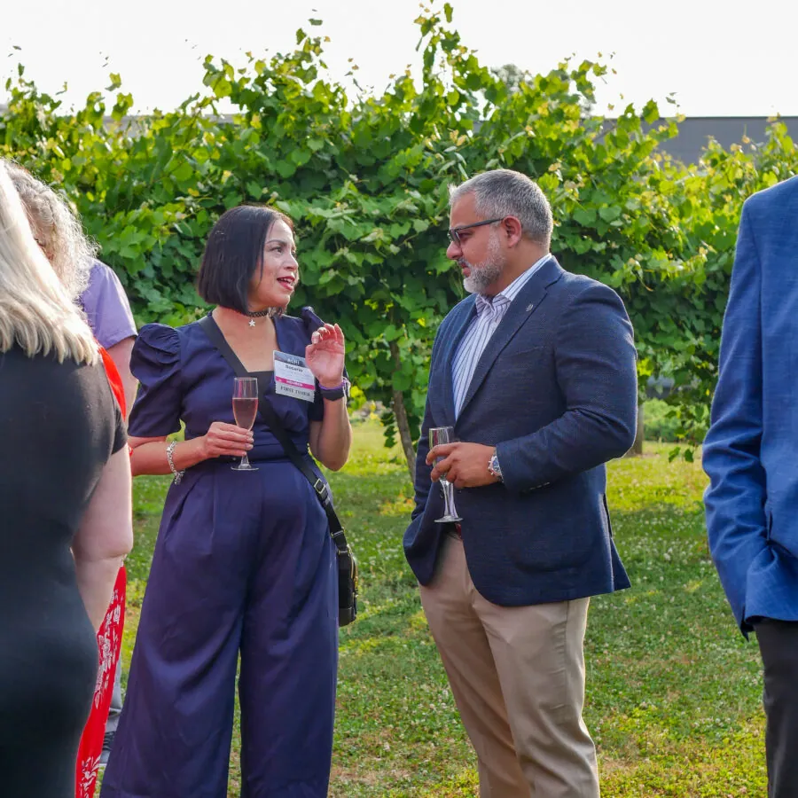 Guests talking at outdoor event