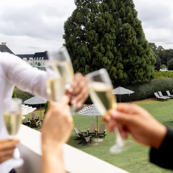Close-up of champagne glasses clinking