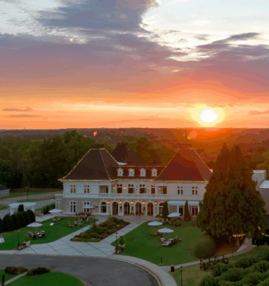 Elegant estate building with sunset view